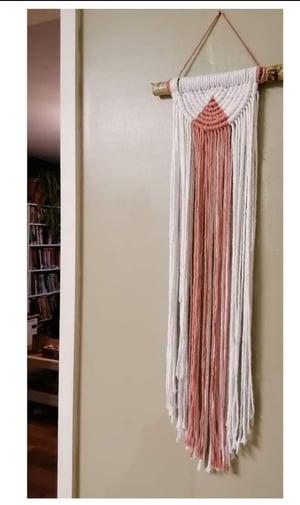 Half circular macrame wallhanging with swag. 