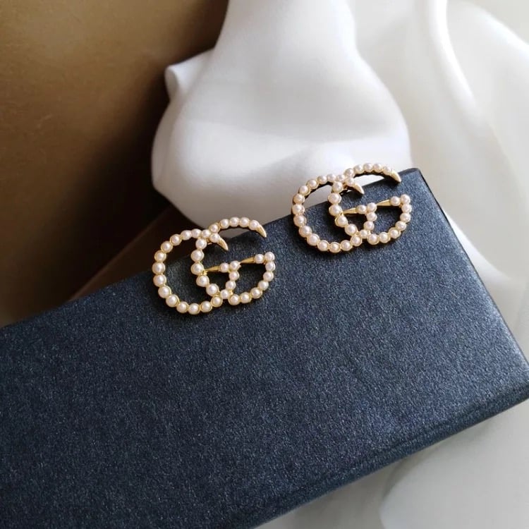 GG earrings with faux pearls in gold - Gucci