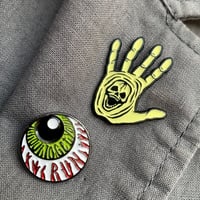 Image 1 of Enamelled Skullhand + Eyeball Pin Badge Set