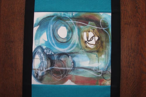Image of Turquoise 'Colliding' table runner