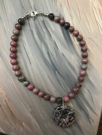 Rhodonite Stone with wrapped donut  charm