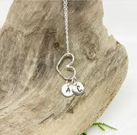 Image 1 of MONOGRAMMED STERLING SILVER HAMMERED FLOATING HEARTS ON A SILVER CHAIN