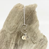 Image 2 of MONOGRAMMED STERLING SILVER HAMMERED FLOATING HEARTS ON A SILVER CHAIN
