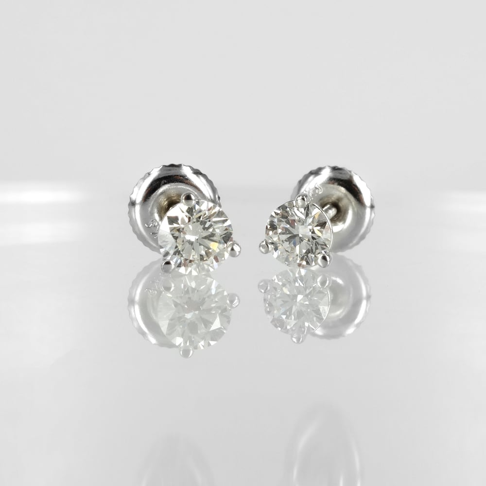 Image of 14k white gold diamond stud earrings. Set with 2 diamonds = .70ct FSI total weight. PJ5842