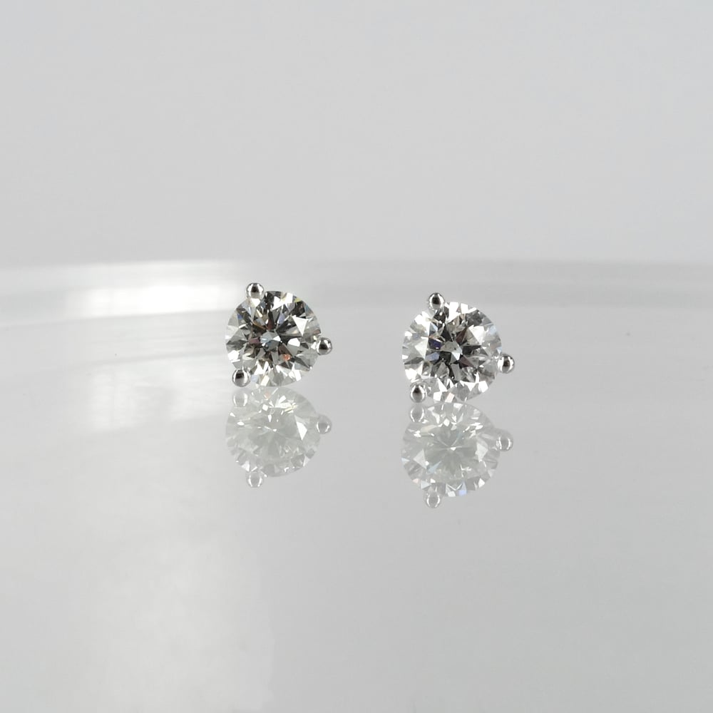 Image of 14k white gold diamond stud earrings. Set with 2 diamonds =.82ct GSI1 XXX total weight. PJ5887