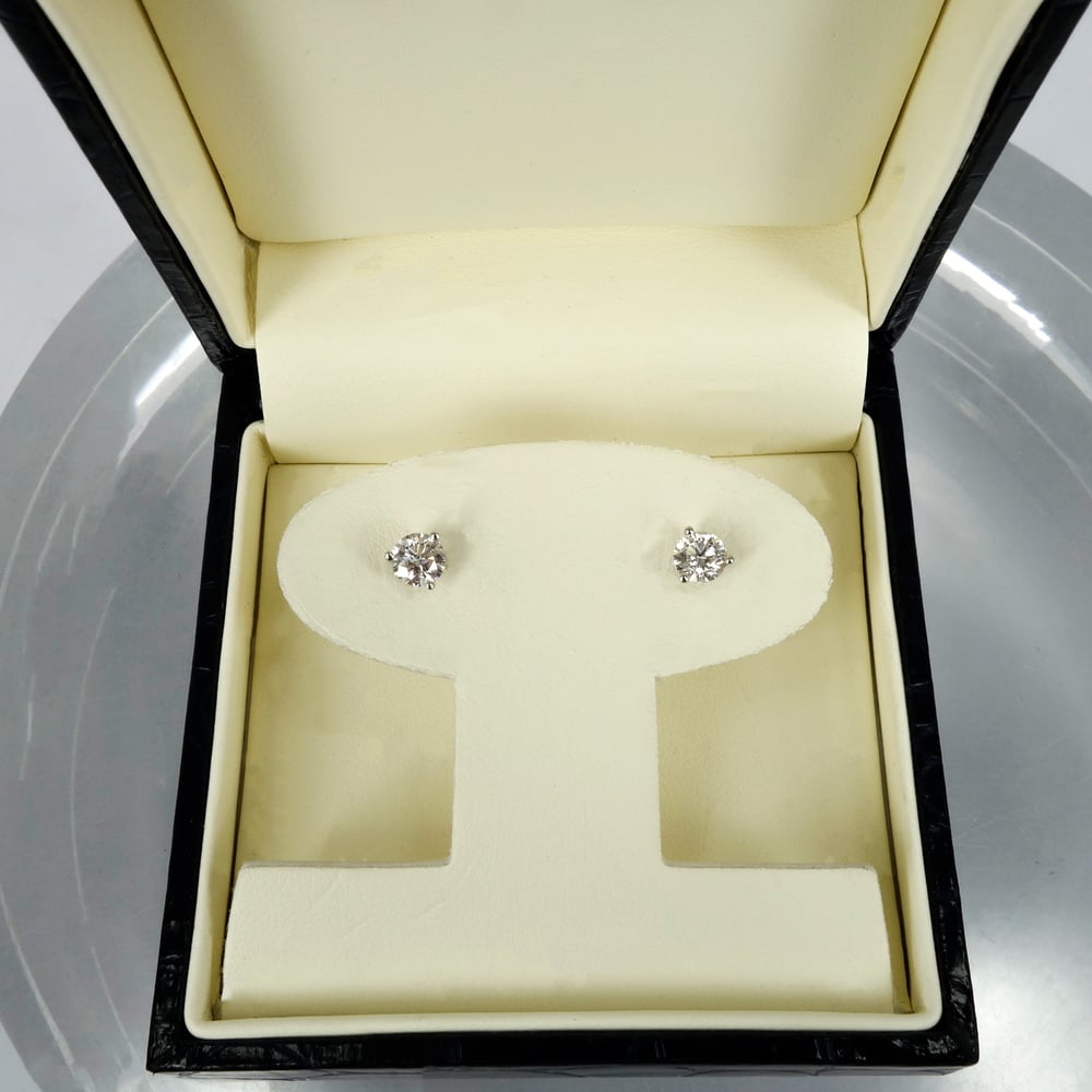Image of 14k white gold diamond stud earrings. Set with 2 diamonds =.82ct GSI1 XXX total weight. PJ5887