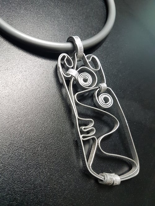 Image of face pendant #2