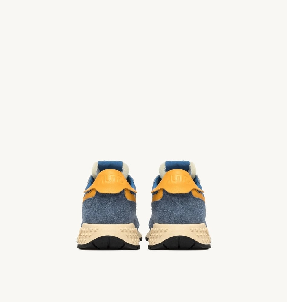 Image of AUTRY REELWIND LOW SNEAKERS IN CENBLE AND GOLD