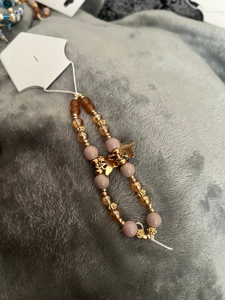 Image of brown butterfly phone charm 