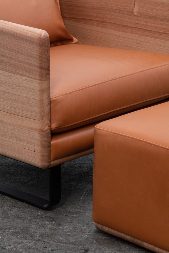  CLOVER LOUNGE OTTOMAN IN TASMANIAN OAK WITH TOBACCO LEATHER