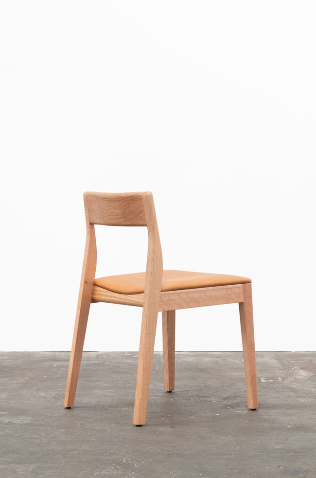 ROSE DINING CHAIR IN TASMANIAN OAK WITH AN UPHOLSTERED TAN LEATHER SEAT
