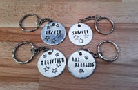 Hand stamped pronoun keyrings