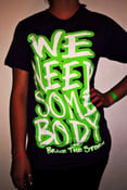 Image of  Purple/Green "We Need Somebody" T-shirts