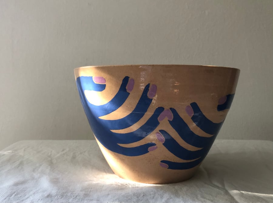 Image of blue hands holding :: bowl