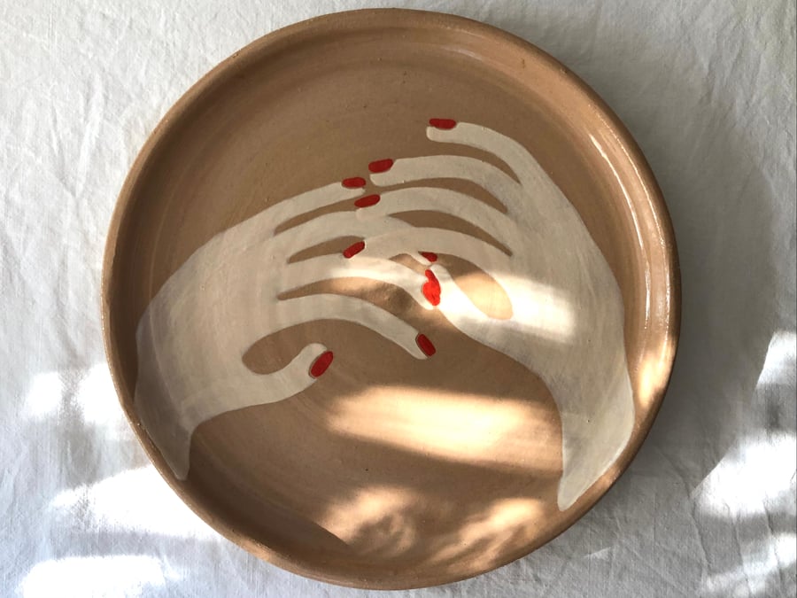 Image of hands touching :: plate