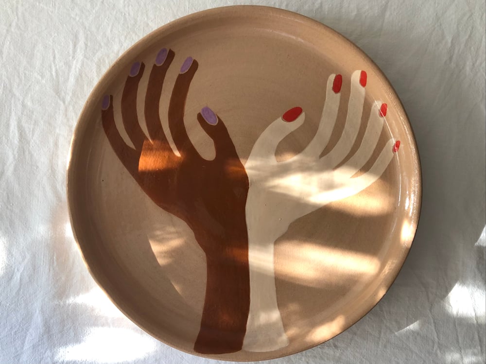 Image of hands holding together :: plate