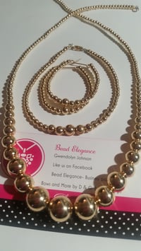 Image 1 of Classy Gold