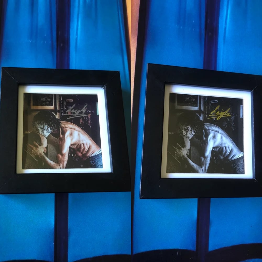 Signed “Joker (2019)” photo in a frame. Colour or B&W.