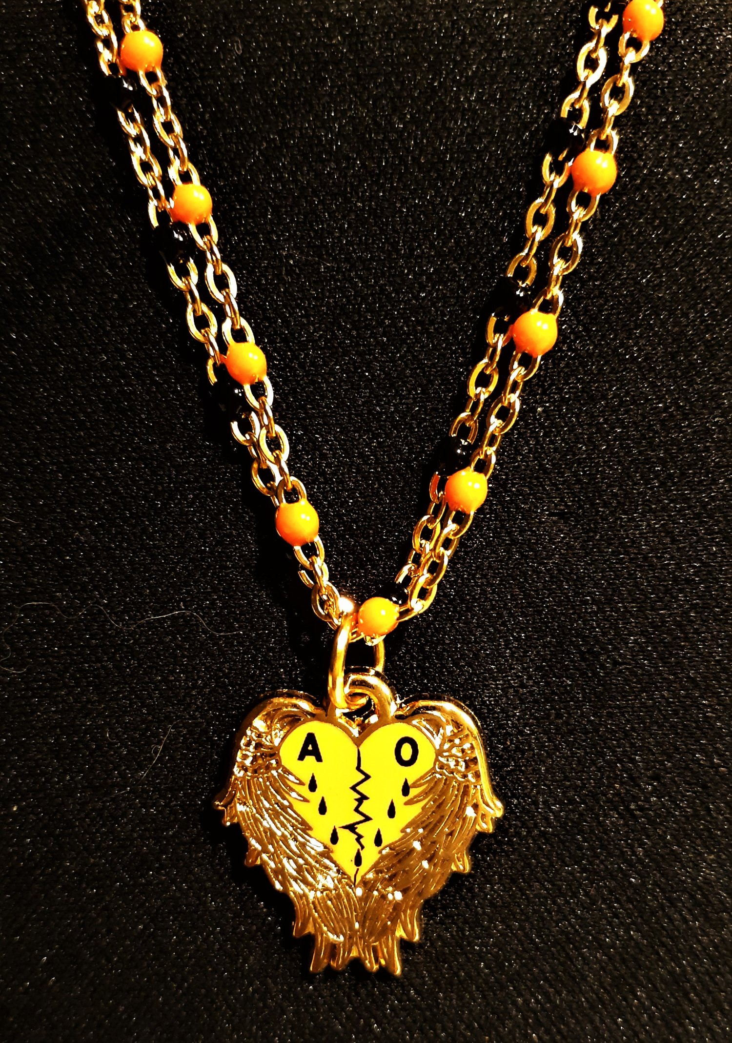Image of Agent Orange Angel Heart Necklace