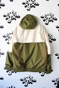 Image of mean green jacket in tan and army green 