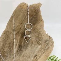 Image 1 of STERLING SILVER HAMMERED TRIO OF SHAPES ON A SILVER CHAIN