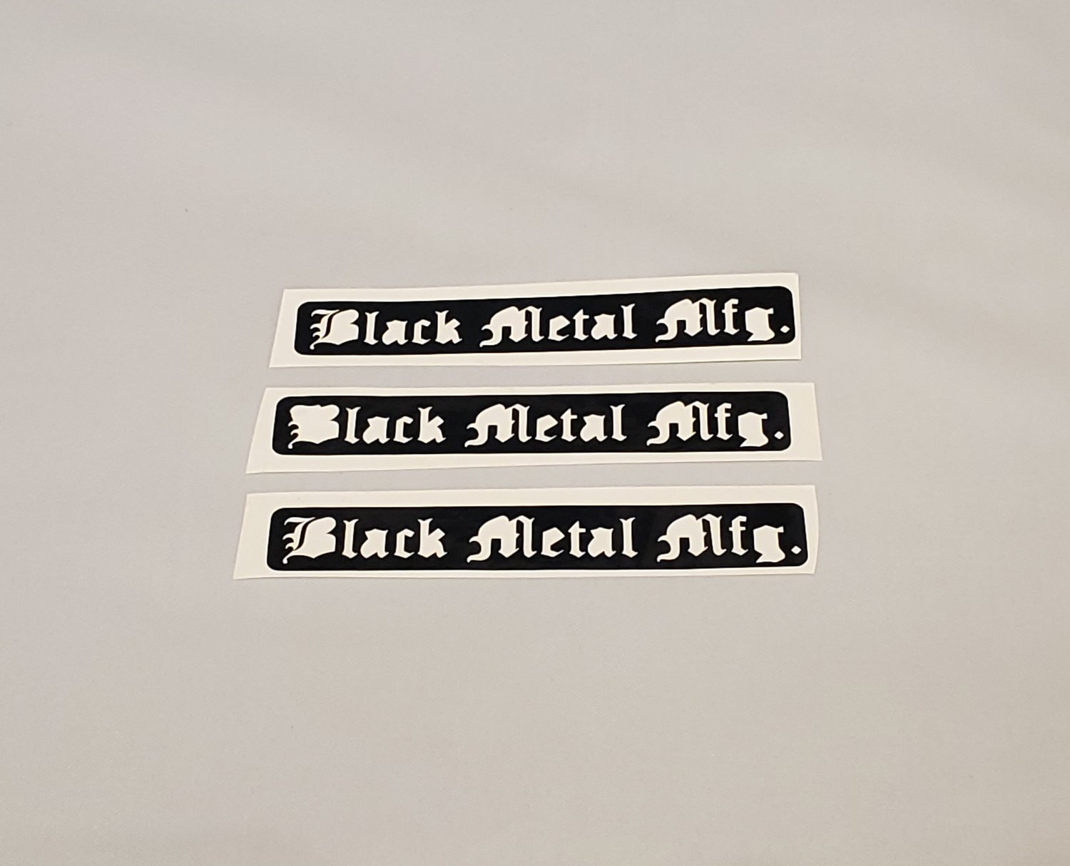 Image of Black Metal Mfg. Sticker (1)