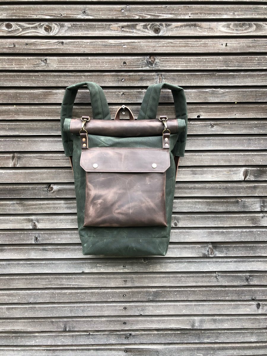 Image of Backpack in waxed canvas with waxed leather front pocket and roll to close top