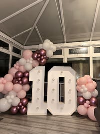 White marquee numbers make of wood with light bulbs.  Is 4 ft tall 