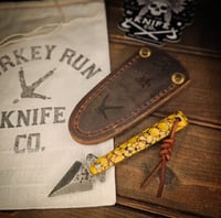 Image 1 of BROKEN ARROW • yellow dino bone