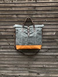 Image 2 of Waxed canvas roll top tote bag with luggage handle attachment leather handles and shoul