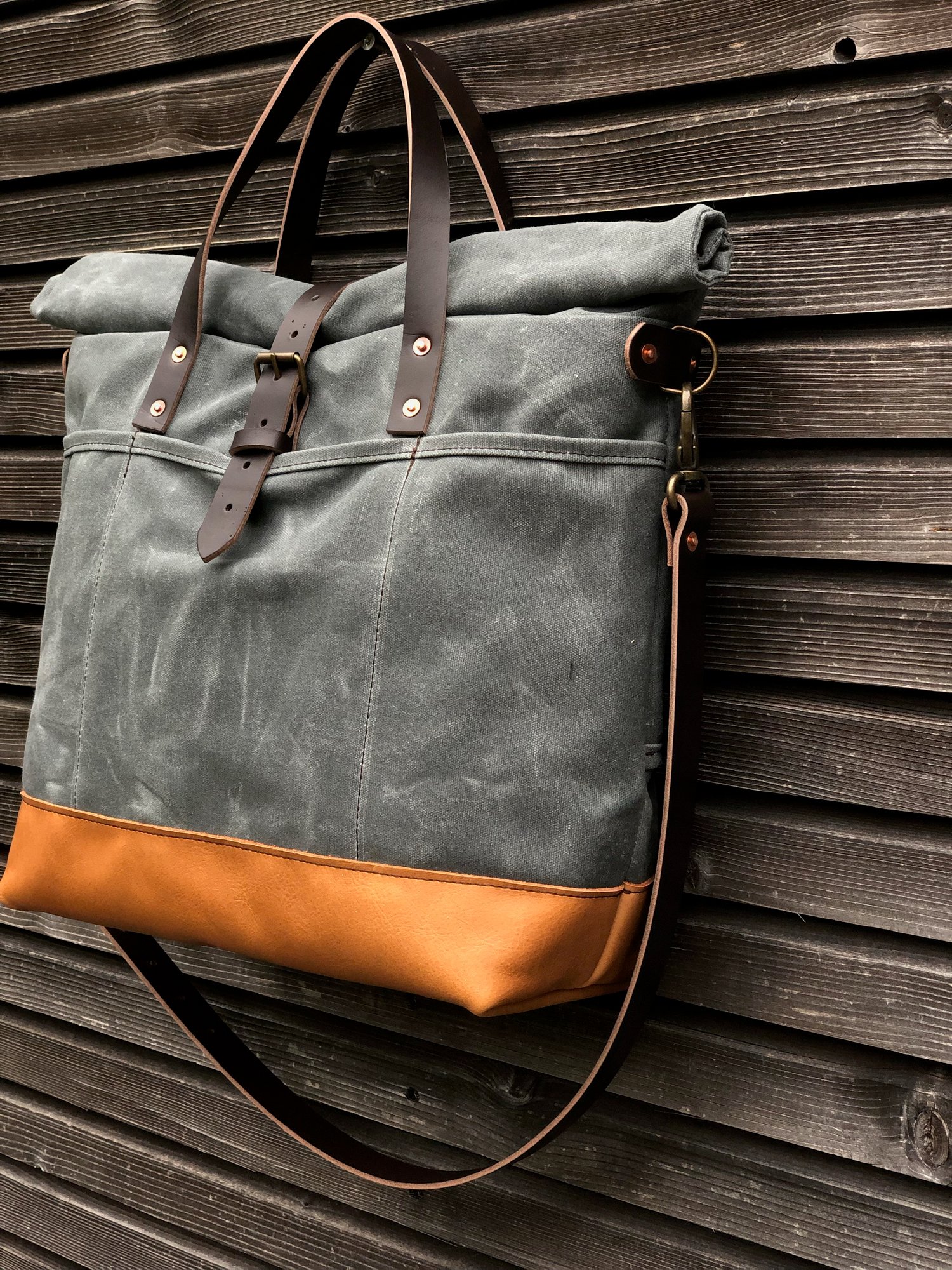Image of Waxed canvas roll top tote bag with luggage handle attachment leather handles and shoul