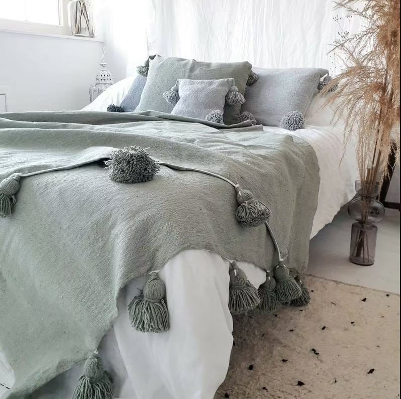 Image of MOROCCAN POMPOM BLANKET - GREEN