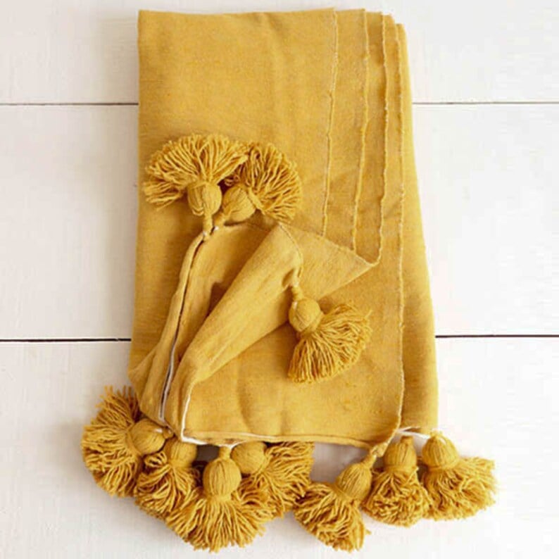 Image of MOROCCAN POMPOM BLANKET - MUSTARD