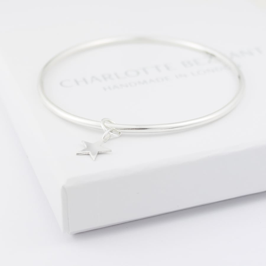 Image of Handmade silver bangle with a five pointed star