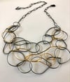 Loop necklace in black & Gold