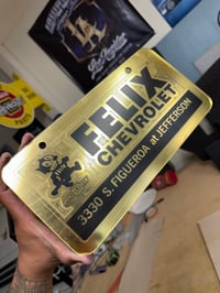 GOLD & BLACK FELIX CHEVROLET ICONIC LICENSE PLATE 