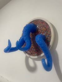 Image 4 of Triple blue tentacles on white wound base with sprinkles