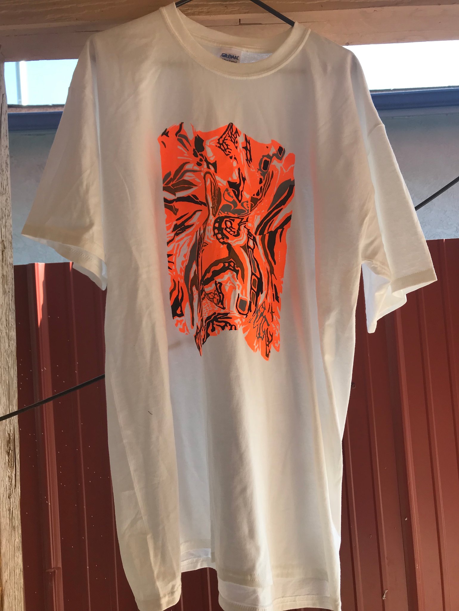 Image of neon orange/ multicolored on white tee XL