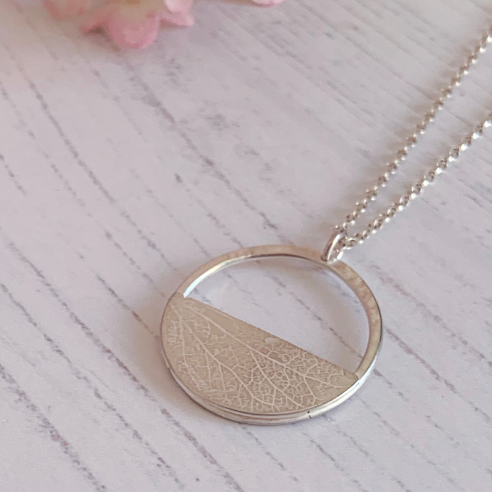 Image of Recycled sterling silver circle pendant necklace, with half moon. 
