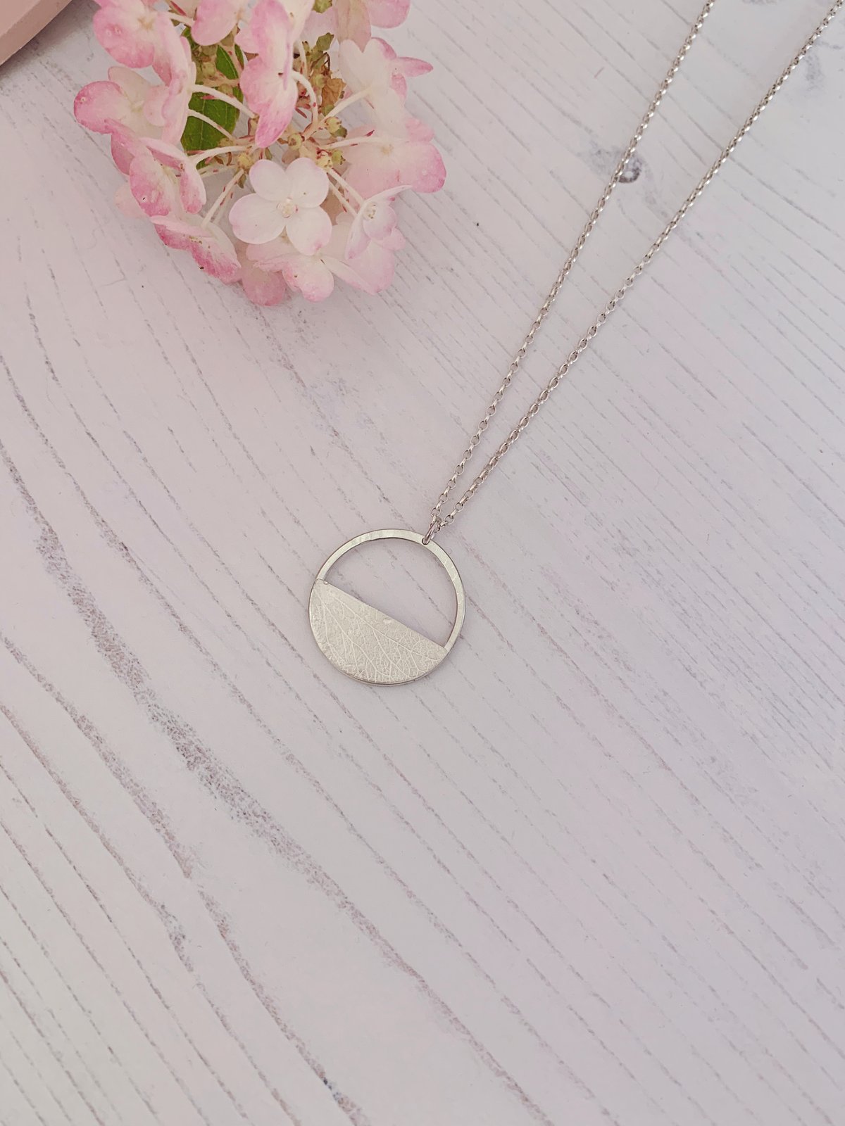 Image of Recycled sterling silver circle pendant necklace, with half moon. 