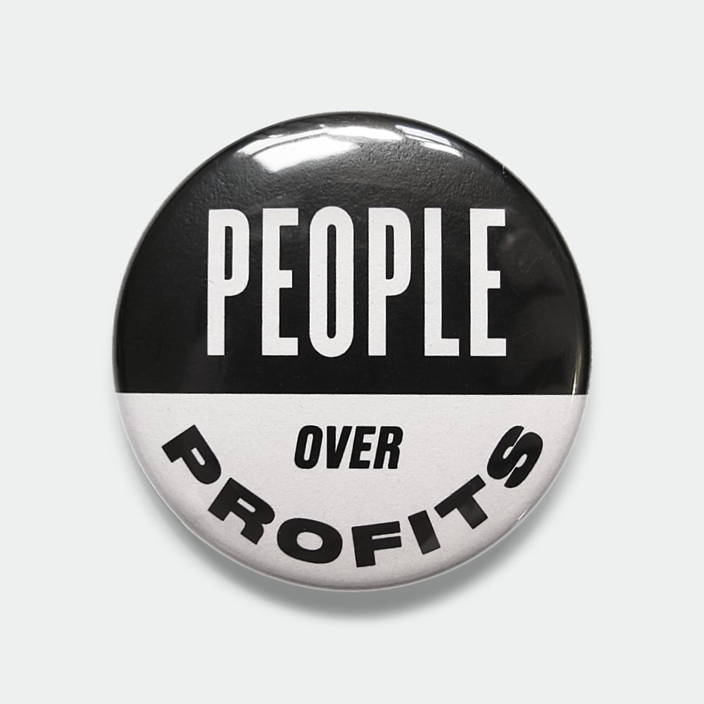 Image of People Over Profits black & white 1.5" pin