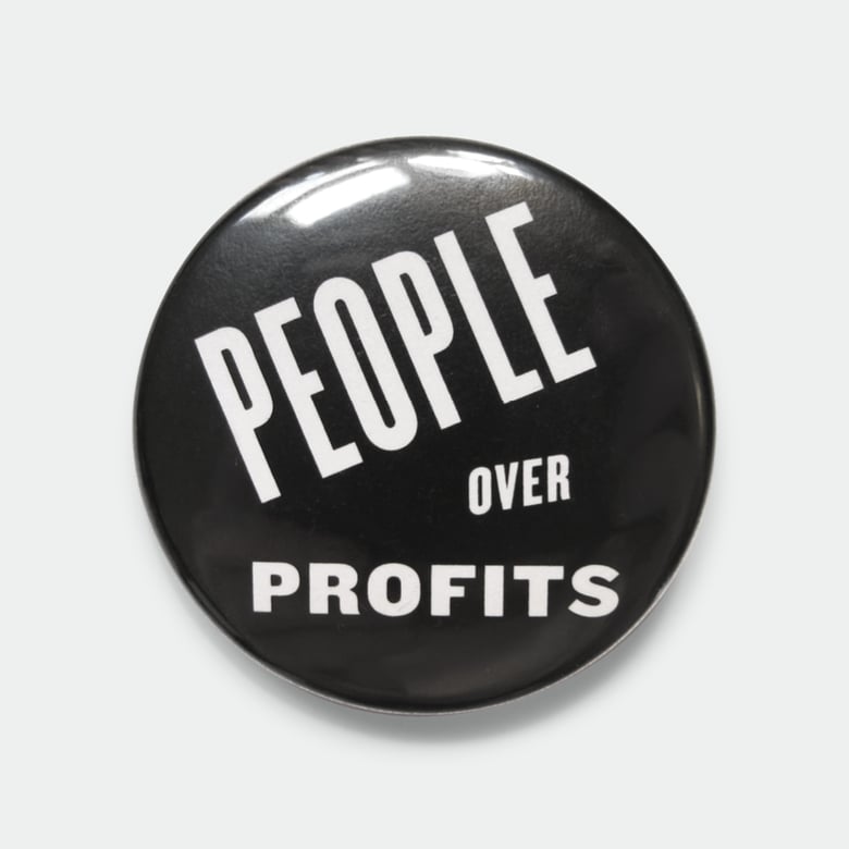 Image of People Over Profits black 1.5" pin