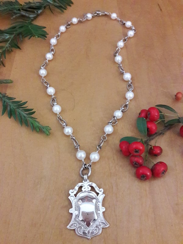 Image of Sterling Shield with White Pearls 4KL