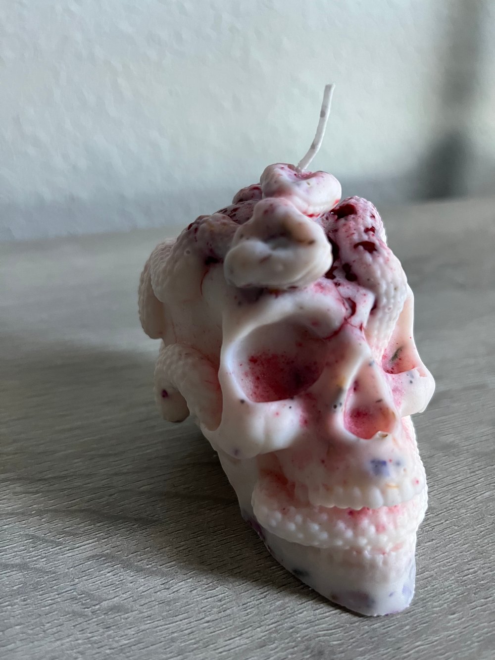 Raspberry lavender snake skull candle
