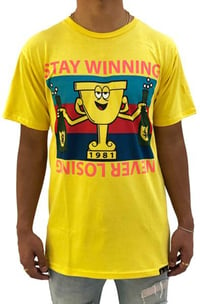 Image 1 of Stay Winning Never Losing Trophy Yellow Tee