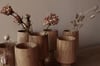 Upside down sweet chestnut bud vase