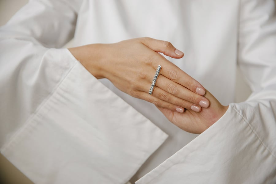 Image of silver plain ring with inscription in Latin