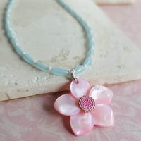 Image 1 of Carved Pink Mother of Pearl Shell Pendant on a Necklace of Small Pale Blue Rice Beads