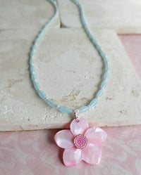 Image 3 of Carved Pink Mother of Pearl Shell Pendant on a Necklace of Small Pale Blue Rice Beads