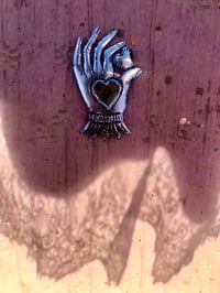 Image 1 of Heart in hand milagro